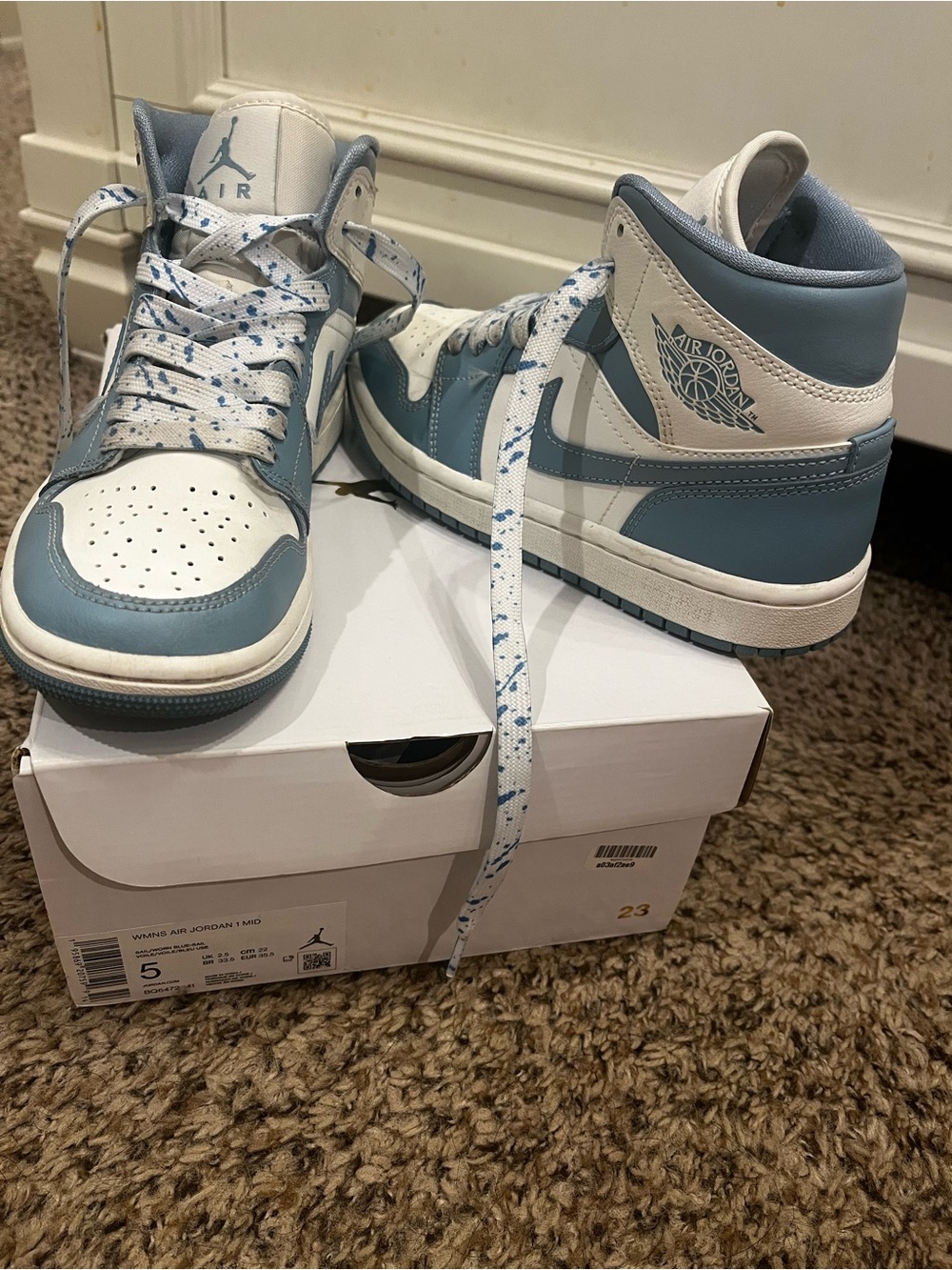 Nike Women’s Air Jordan 1 Mid White and Light Blue Sneakers